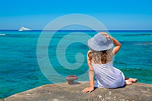 Girl looking at beach in Formentera turquoise Mediterranean