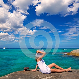 Girl looking at beach in Formentera turquoise Mediterranean