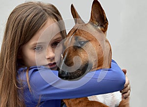 Girl looking for comfort with her dog