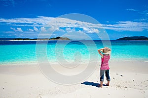 Girl looking at the deserted tropical islands