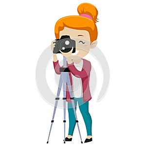 Girl Looking through a Digital Camera on Tripod