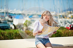 Girl looking for direction in Cannes, France