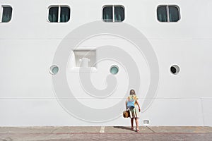 Girl looking down near passenger liner