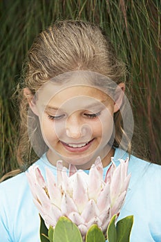 Girl Looking At Fresh Flower