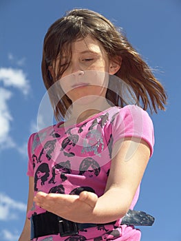 Girl looking at hand