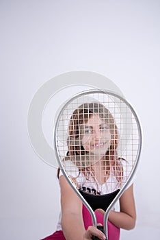 Girl looking happy with tennis racket