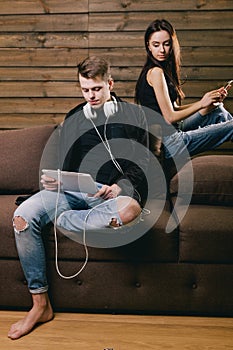 Girl looking at her boyfriend tablet