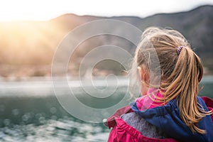 Girl looking at landscape of Kotor Bay