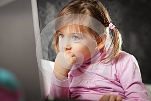 Girl looking at laptop screen