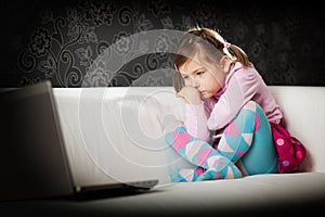 Girl looking at laptop screen