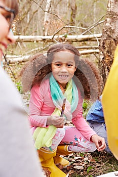 Girl Looking For Minibeasts At Activity Centre