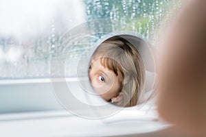 Girl looking into the mirror