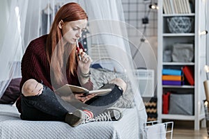 Girl looking at notebook