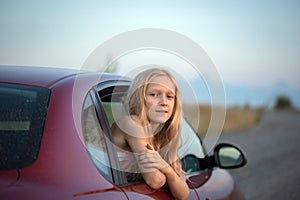 Girl looking out the car photo