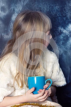 Girl looking out the frost window