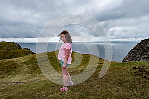 Girl looking out over the Slieve League Cliffs, County Donegal, Ireland