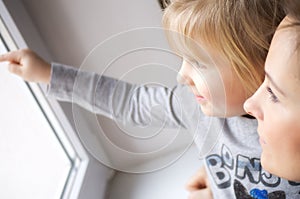 Girl looking out of window