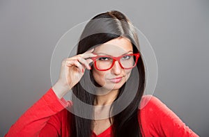 Girl looking over glasses