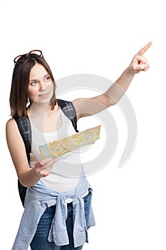 Girl looking for place on map with rucksack