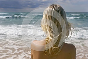 Girl looking into sea