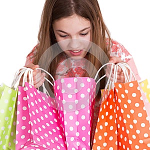 Girl looking into shopping bags