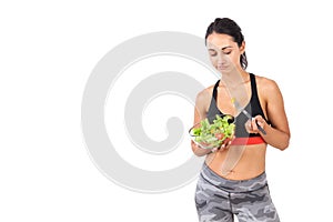 Girl looking skeptically at salad