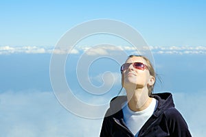 Girl looking in the sky photo