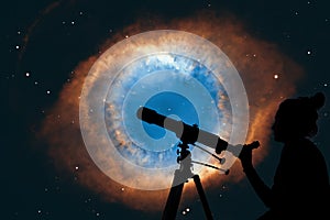 Girl looking at the stars with telescope. The Helix Nebula