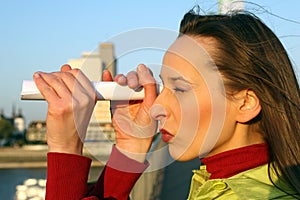 Girl looking through telescope