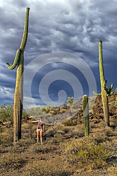 The girl looks at the huge cactus - Carnegie giant