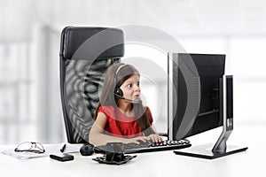 Girl looks in the monitor.