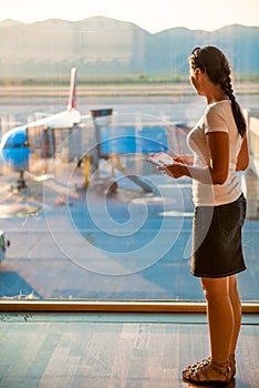 Girl looks on the plane