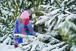 Girl lost in winter forest. lost in the woods and has a frightened face. Child crying in the forest