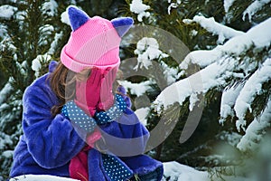 Girl lost in winter forest. lost in the woods and has a frightened face. Child crying in the forest