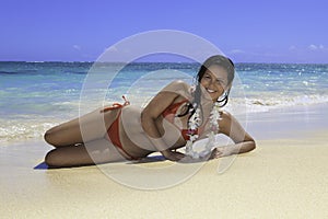 girl lounging on the sand