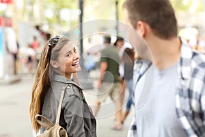 Girl in love meeting her crush on the street