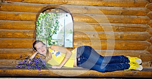 Girl lying on bench of bathhouse photo