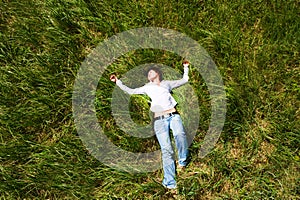 Girl lying down of grass