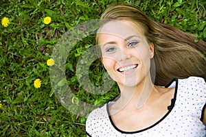 Girl lying down of grass