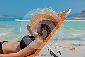 Girl lying down on lounger on Balos beach