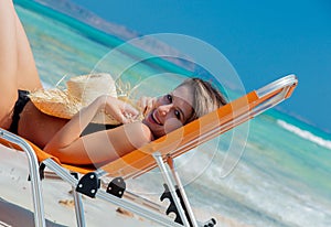 Girl lying down on lounger on Balos beach