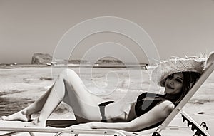 Girl lying down on lounger on Balos beach