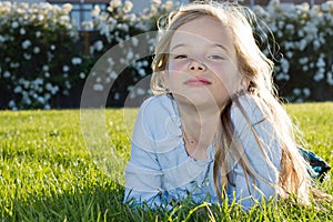 Girl lying in grass