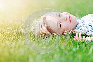 Girl lying in grass