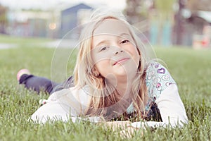 Girl lying in grass