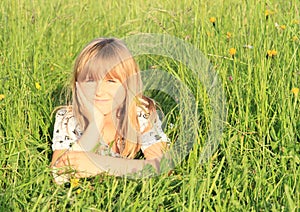 Girl lying in grass