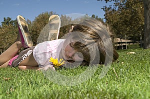 Girl lying on grass