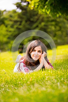 Girl lying on the grass in the park