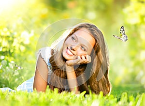 Girl Lying on Green Grass