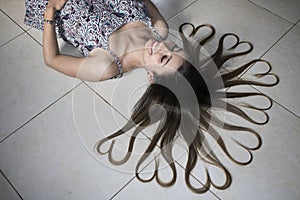 Girl lying with hair heart photo